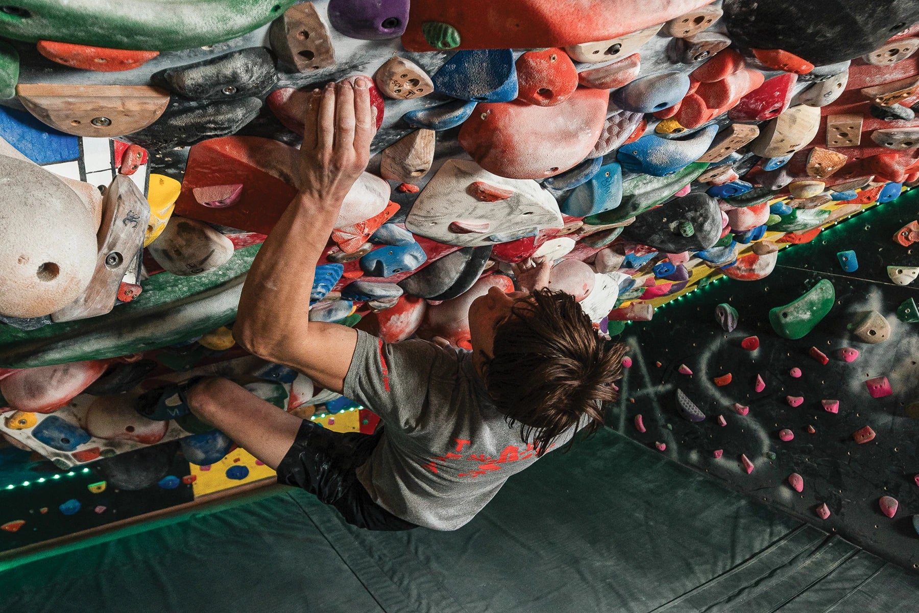 Homewall - Trango - Climber, aggressively climbing a personal homewall.